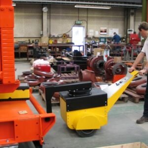 Operator guiding Super PowerPusher® to move heavy equipment safely