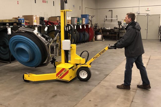MFC-100™ Hydraulic Industrial Cart transporting heavy equipment in a warehouse