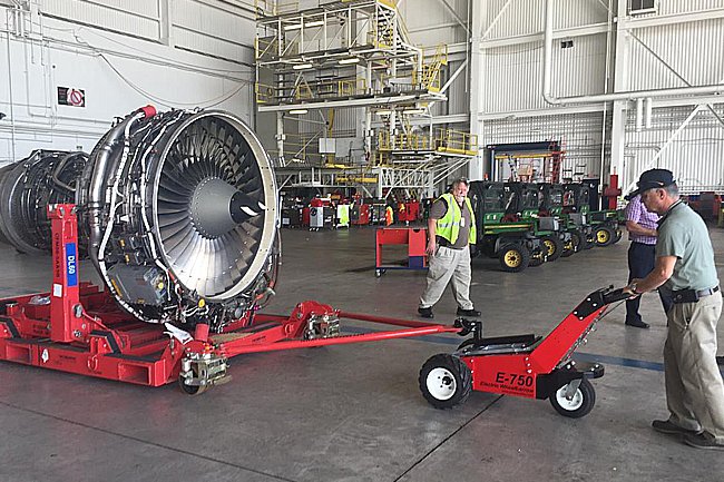 E-750 Trailer Mover™ towing industrial machinery inside a warehouse